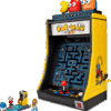 A highly detailed replica of a retro arcade game machine built entirely from bricks celebrating the classic PAC-MAN Arcade LEGO design with a bright yellow cabinet casing