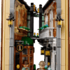 Sherlock Holmes Book Nook wooden 3D puzzle diorama showing an illuminated miniature library with a spiral staircase and warm chandelier lighting