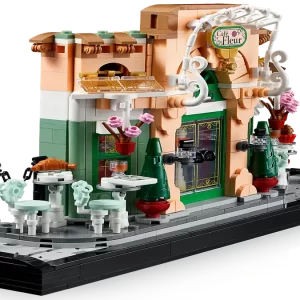 French Café Dust Enclosure holding the LEGO bistro set flush inside a packed home library bookshelf