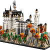 LEGO Bavarian Castle architecture display model featuring the detailed white towers and spires of Neuschwanstein built over rocky cliffs with colorful autumn trees