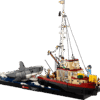 LEGO Jaws Shark cinematic display model featuring the Orca fishing boat alongside a large brick built great white shark emerging from a dark blue tiled ocean base