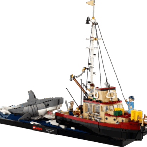 LEGO Jaws Shark cinematic display model featuring the Orca fishing boat alongside a large brick built great white shark emerging from a dark blue tiled ocean base
