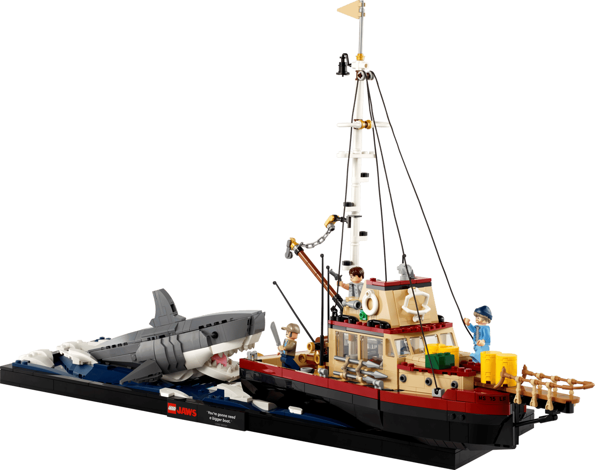 LEGO Jaws Shark cinematic display model featuring the Orca fishing boat alongside a large brick built great white shark emerging from a dark blue tiled ocean base