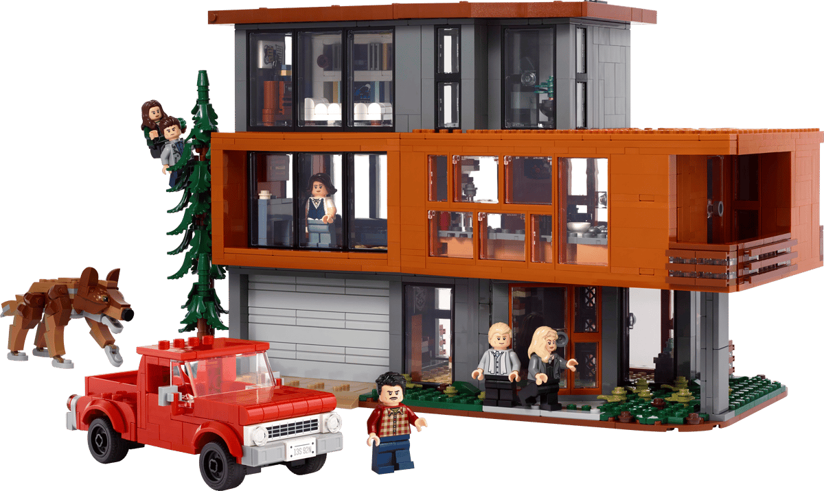 LEGO Twilight The Cullen House large scale architectural model showing the three tier modern wood and glass mansion surrounded by green forest trees on a clean presentation backdrop
