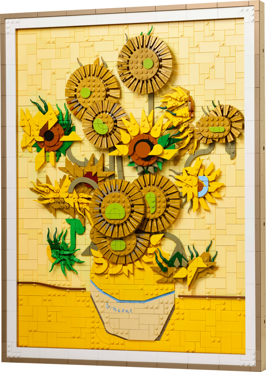 LEGO Vincent van Gogh Sunflowers 3D art set hanging on a wall inside a premium black frame showing detailed gold and yellow textured petals