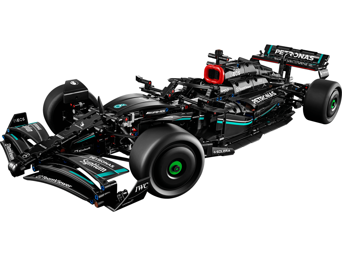 LEGO Mercedes-AMG F1 W14 E Performance model built in a stealth matte black racing livery with petronas green stripes displayed on a clean showroom floor