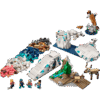 A macro display showing a completed Arctic Animals LEGO scene with a large white polar bear holding a fish standing next to its small cub on a white brick ice floe surrounded by translucent blue water plates