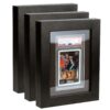 Deluxe PSA Graded Card Frame displaying fifteen graded Pokémon cards in a clean black wooden frame on a modern wall