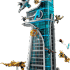 LEGO Avengers Tower Marvel model built standing over three feet tall with transparent blue window walls featuring a small brick-built Quinjet banking away from the hangar platform