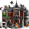 The factory presentation packaging for the massive Arkham Asylum Set showing the open rear modular play zones filled with villain minifigures and an Arkham transport truck