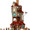 LEGO Harry Potter The Burrow Collectors Edition model built showing its precariously stacked multi story wooden architecture and uneven roofs set against a clean backdrop