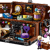 A beautiful macro display of the opened Wednesday LEGO Set showing Thing's trunk apartment split into two levels filled with a bed armchair and a miniature shower station