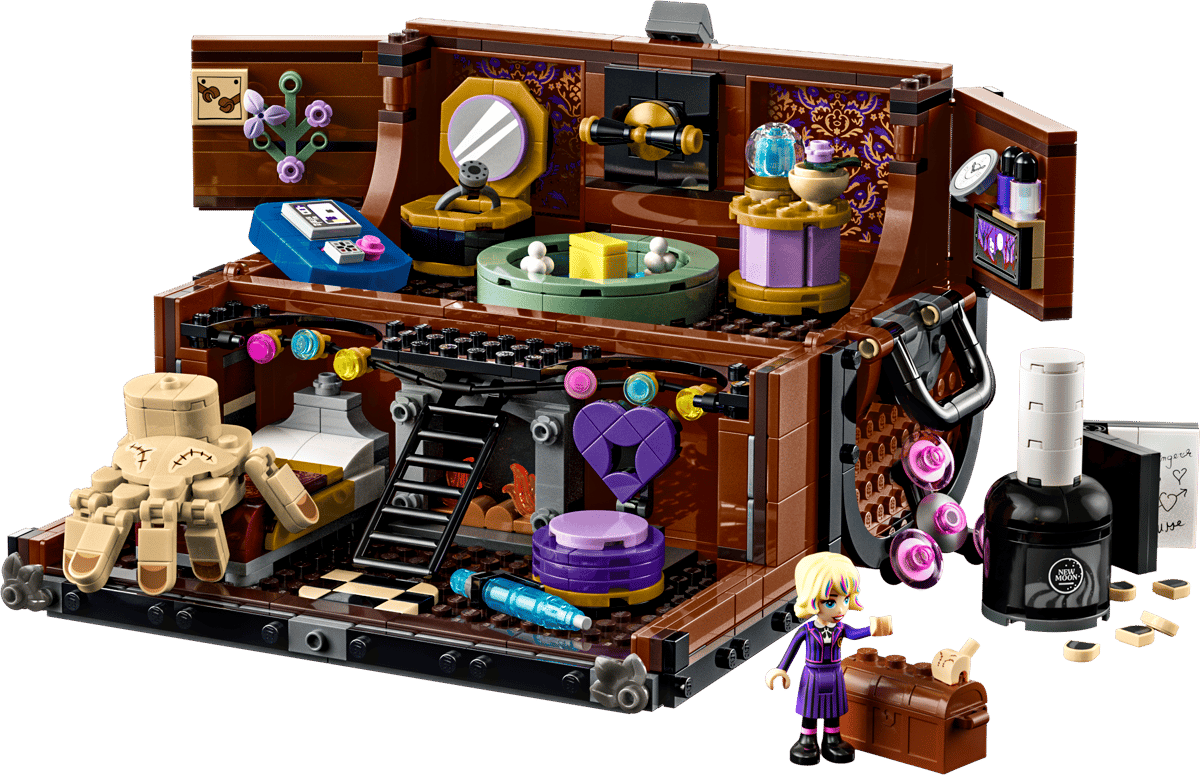 A beautiful macro display of the opened Wednesday LEGO Set showing Thing's trunk apartment split into two levels filled with a bed armchair and a miniature shower station