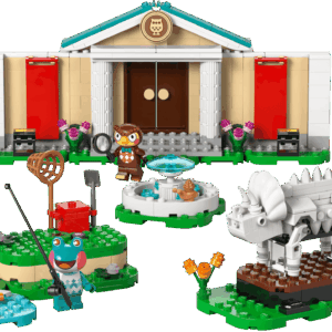 The completed Blathers Museum LEGO building showing the tan facade with a green roof owl crest medallion and twin white pillars standing behind an outdoor fountain a triceratops fossil skeleton and a frog villager minifigure fishing