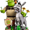 The factory packaging for the premium LEGO Shrek Set displaying the large brick built Shrek holding an onion alongside a gray brick built Donkey on a swamp base