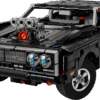 LEGO Dodge Charger R/T Car Technic model built in sleek matte black with its supercharger blower protruding from the hood resting in a wheelie stance