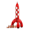 The LEGO Tintin Rocket Ideas set showing the brick-built red and white checkered rocket along with Tintin and Snowy minifigures in orange space suits
