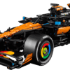LEGO Technic McLaren MCL39 open wheel Formula 1 race car model showing the papaya orange front wing nose cone and authentic sponsor branding