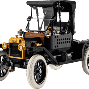 LEGO Ford Model T vintage car model built in classic black with brass colored headlights and spoked wheels displayed on a wooden table