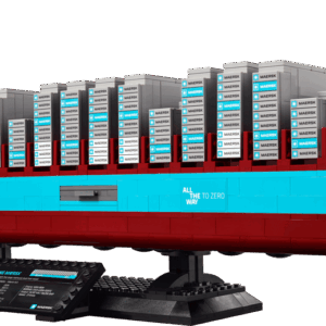 A large detailed brick built container ship representing the Maersk Vessel LEGO set featuring a black and dark red hull stacked with multi colored cargo containers