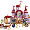 LEGO Disney Castle model kit from Beauty and the Beast showing the purple and crimson towers alongside figures of Belle and the Beast