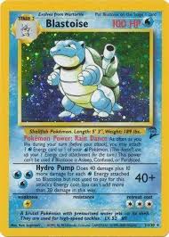 Hydro Shell Deck protecting a raw Base Set Blastoise Holo Pokemon card